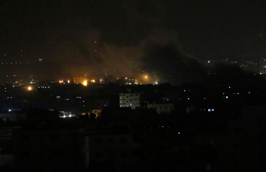 FILE - An explosion by Israeli airstrikes is seen in Gaza City, on August 18, 2020.