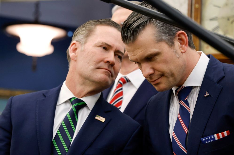 White House National Security Advisor Mike Waltz (left) speaks with Secretary of Defense Pete Hegseth