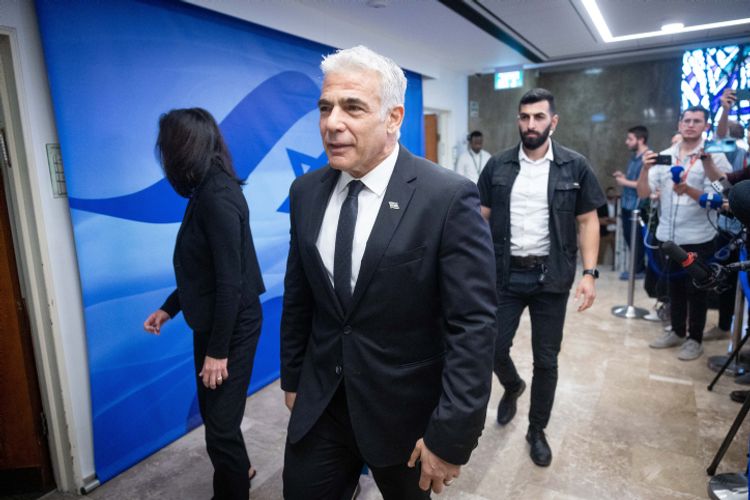 Israeli Foreign Minister Yair Lapid arrives to a cabinet meeting at the Prime Minister's Office in Jerusalem on May 1, 2022.