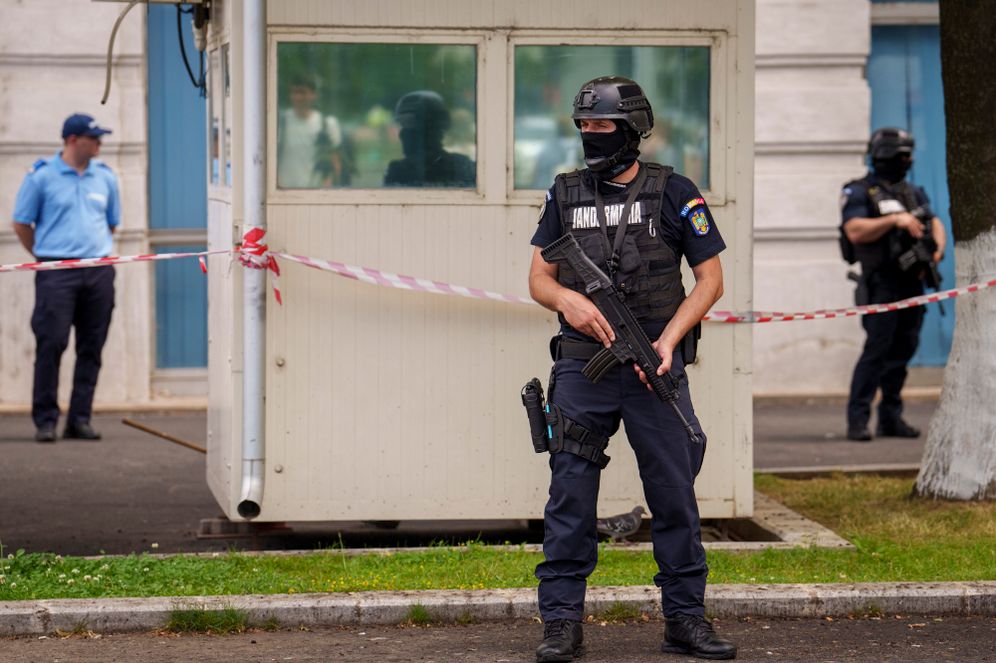 Members of a special unit of the Romanian gendarmerie stand outside the apartment block in which the Israeli embassy is located in Bucharest, Romania, Monday, June 3, 2024. A foreign citizen was detained in Romania's capital on Monday after allegedly attacking the entrance of the Israeli Embassy with a Molotov cocktail, causing a small fire but no casualties, local media and police reported.