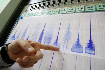 Illustrative image of a geologist recording seismic activity