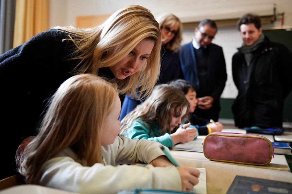 Ukraine's First Lady of Ukraine Olena Zelenska listens to pupils during a visit in a classroom at a primary school for non-native speaker pupils in Paris, France.