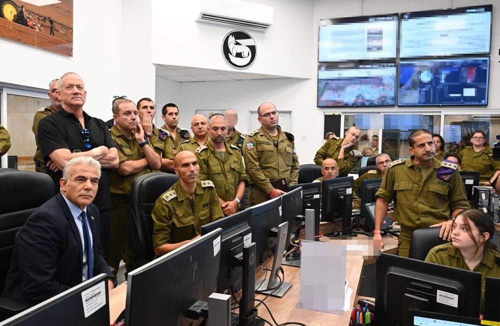 Israel's Prime Minister Yair Lapid (L), Defense Minister Benny Gantz visit the Southern Command, Israel, on August 7, 2022.
