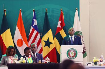President of the ECOWAS Commission Jean-Claude Kassi Brou (R) speaks in Accra, Ghana, on July 3, 2022.