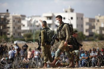 Israeli soldiers stand guard in the West Bank city of Jenin, on September 06, 2021.