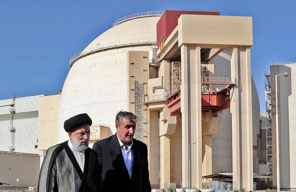 Iran's President Ebrahim Raisi (L) accompanied by chief of the Atomic Energy Organisation of Iran Mohammad Eslami at the Bushehr Nuclear Power Plant, in Bushehr, Iran, October 8, 2021.