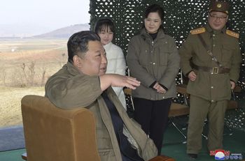 North Korean leader Kim Jong Un accompanied by his wife Ri Sol Ju (second from right) and his daughter at a test firing of a Hwasong-17 intercontinental missile, November 19, 2022.