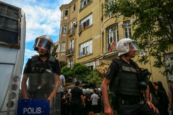 Turkish police officers cordon an area off during the LGBTQ Pride March in Istanbul, Turkey, on June 26, 2022.