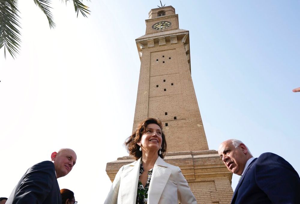 UNESCO Director-General Audrey Azoulay (C) visits the al-Qushla clock tower which has become a place for free expression, in central Baghdad, Iraq.