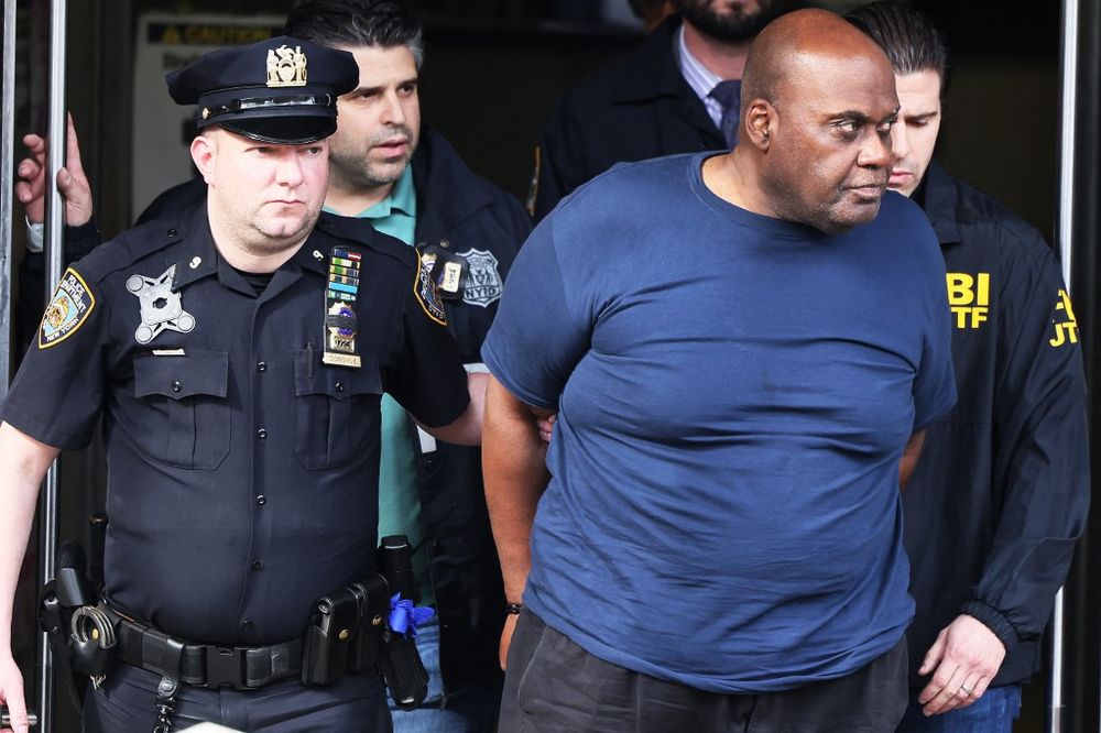 Suspect Frank James is led by police from Ninth Precinct after being arrested for his connection to the mass shooting at the 36th St subway station on April 13, 2022 in New York City, US.