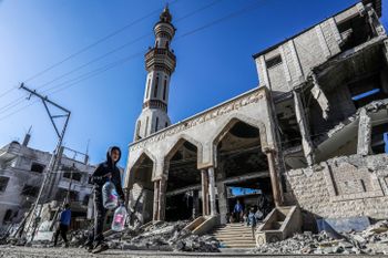 Palestinians at the site of a destroyed Mosque from an Israeli air strike in Rafah, in the southern Gaza Strip, on February 14, 2024.