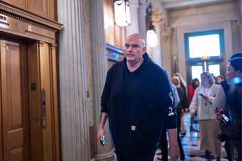 Sen. John Fetterman, D-Pa., arrives as senators prepare for a vote on an Iran war resolution sponsored by Sen. Tim Kaine, D-Va., at the Capitol in Washington, Wednesday, March 4, 2026. 
