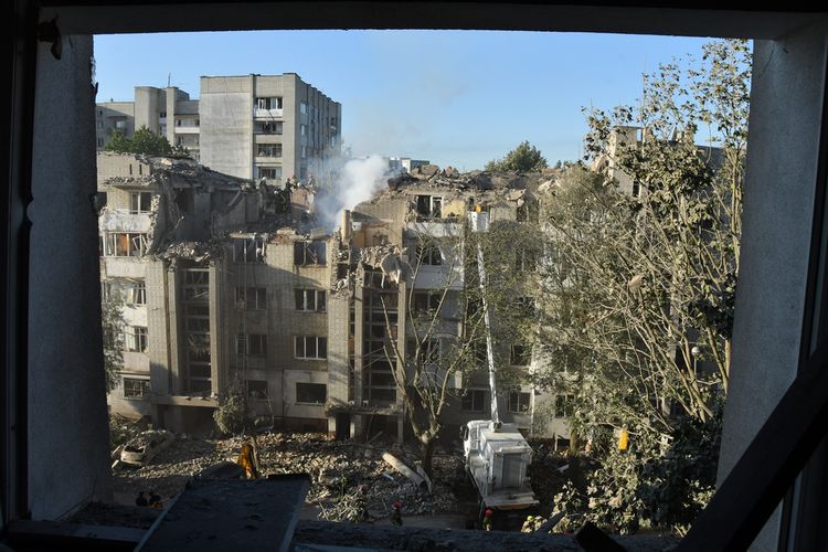 Rescuers search through the rubble of a residential building following a Russian air attack in Lviv, Ukraine, Thursday, July 30, 2026