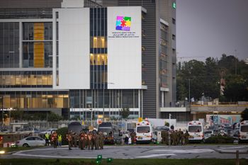 Israeli soldiers wait for the arrival of Israeli hostages at the Schneider Children's Medical Center in Petah Tikva.