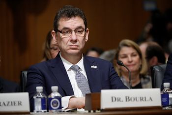 FILE - Albert Bourla, chief executive officer of Pfizer, prepares to testify before the Senate Finance Committee hearing on drug prices, on Capitol Hill in Washington, on February 26, 2019.