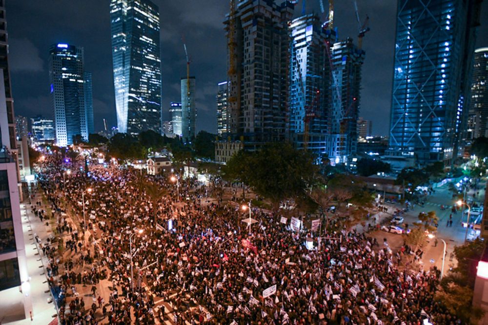Israelis protest against the Israeli government's planned judicial overhaul in Tel Aviv on March 18, 2023.
