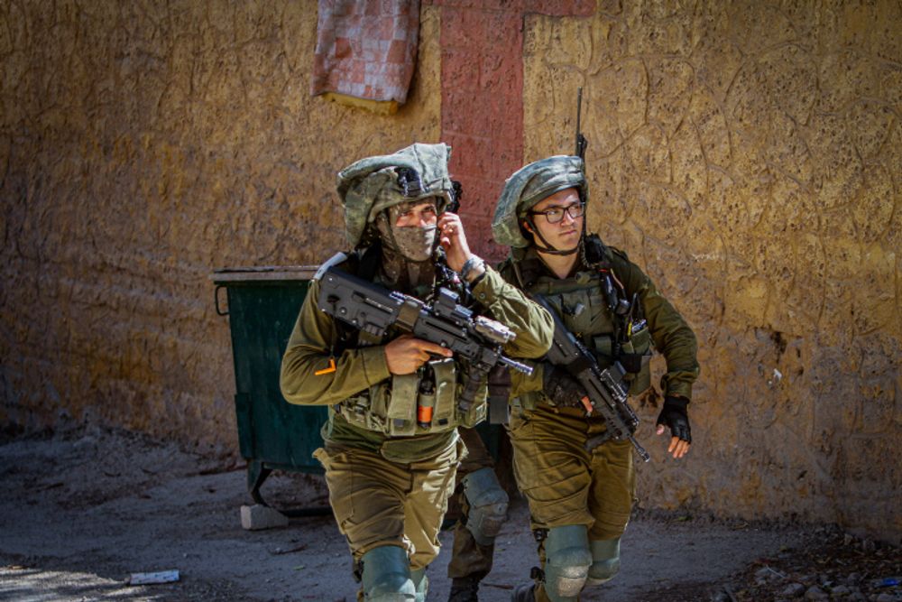 Israeli security forces conduct a search operation in the West Bank near Nablus.