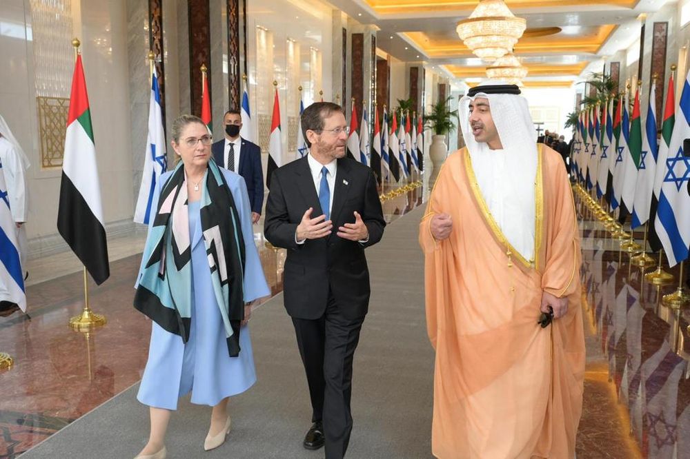 Israeli President Isaac Herzog, (C), and First Lady Michal Herzog, are greeted by Minister of Foreign Affairs and International Cooperation of the United Arab Emirates, Sheikh Abdullah bin Zayed Al Nahyan, Abu Dhabi, January 30, 2022.