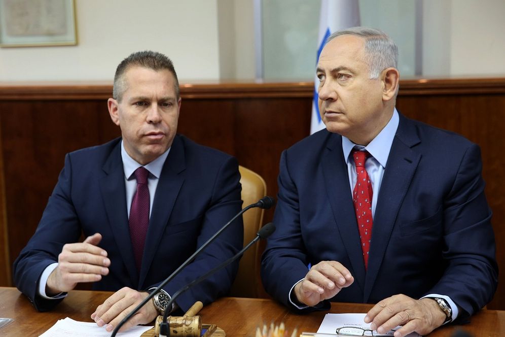 FILE - Israeli Prime Minister Benjamin Netanyahu, right, sits next to Israeli Public Security Minister Gilad Erdan during the weekly cabinet meeting in Jerusalem, Sunday, April 10, 2016
