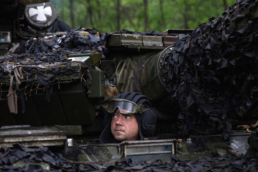 A Ukrainian tanker looks out from his position near Bakhmut, Donetsk region, Ukraine.