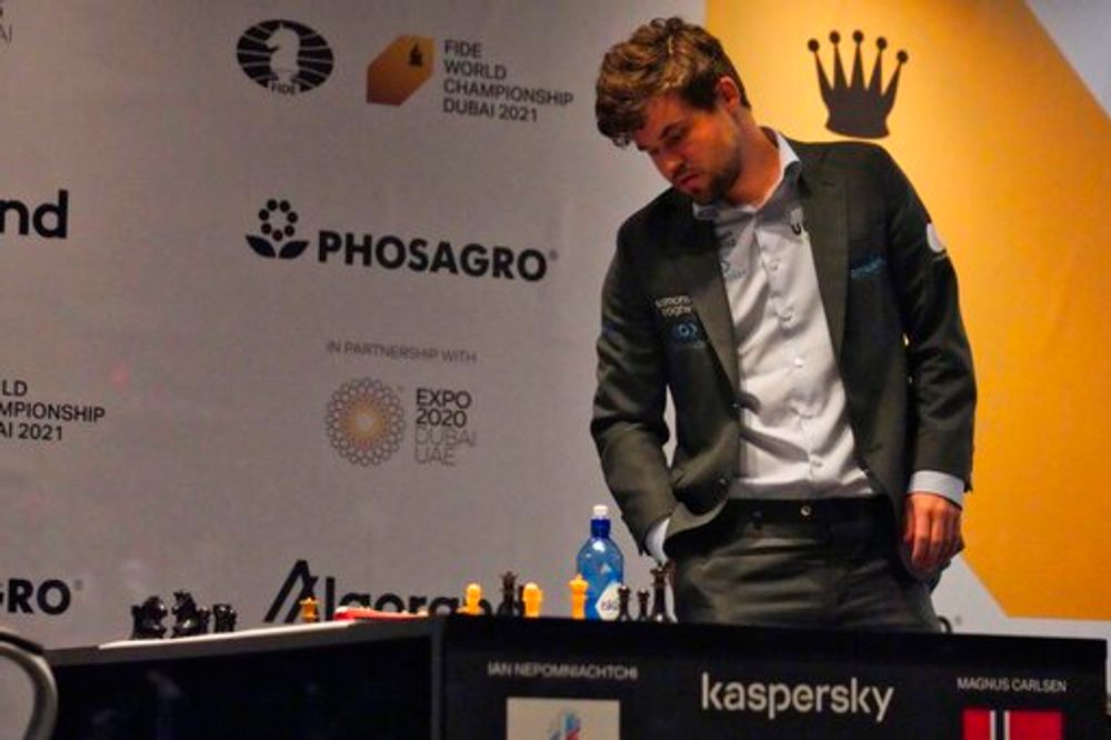 Magnus Carlsen of Norway looks at the board after winning the FIDE World Championship at Dubai Expo 2020 in Dubai, United Arab Emirates, December 10, 2021.