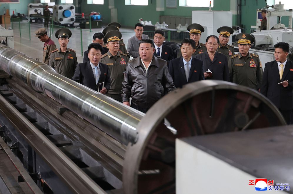 (Korean Central News Agency/Korea News Service via AP) In this photo provided on May 8, 2026, by the North Korean government, its leader Kim Jong Un, center, visits a major munitions factory at an undisclosed location, North Korea Wednesday, May 6, 2026