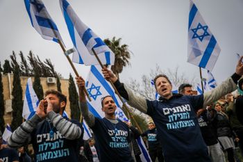 Israelis protest against the planned judicial overhaul outside the home of Head of the Shas party Aryeh Deri in Jerusalem.