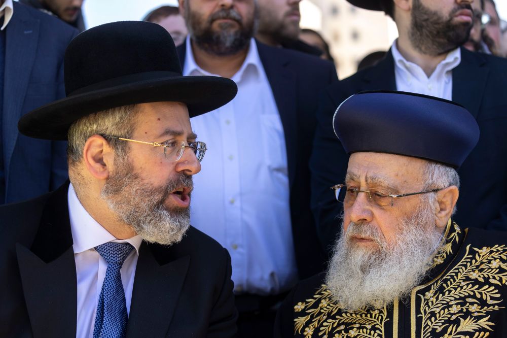 Ashkenazi Chief Rabbi David Lau (L) and Sephardi Chief Rabbi Yitzhak Yosef attend the "Yeshivot March" to call for the strengthening of Jewish identity in the State of Israel against the Conversion Law and Kashrut Law on January 30, 2022 in Jerusalem.
