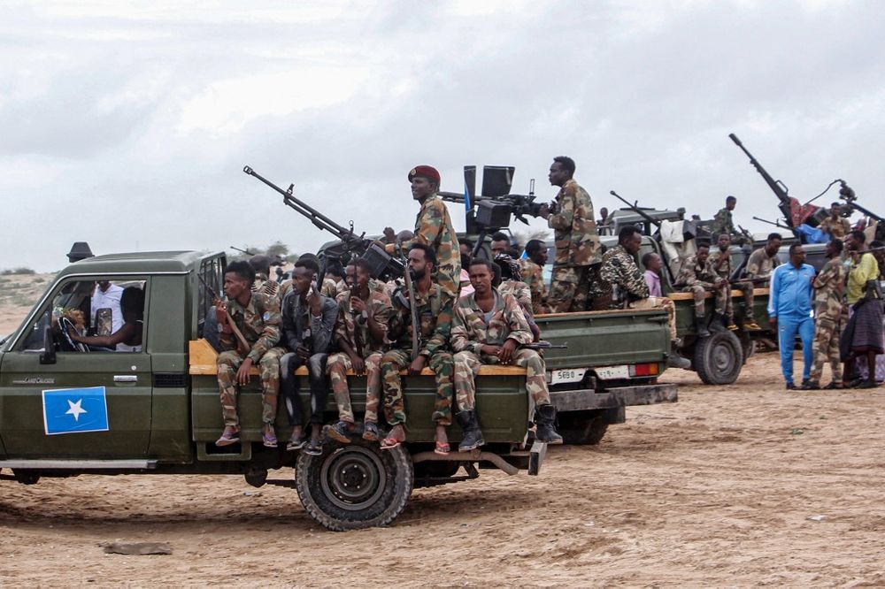 Somali military force members supporting anti-government opposition leaders gather before leaving for their bases in Mogadishu, Somalia, on May 7, 2021.