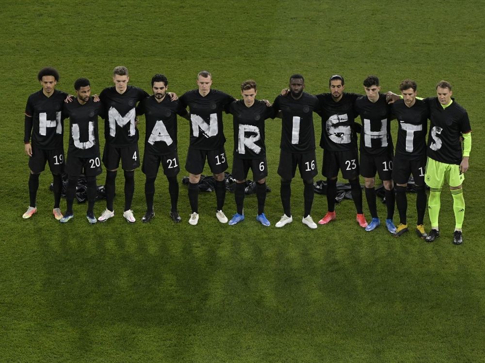 Germany's players pose for a group photo with the wording "Human rights" on their T-shirts prior to the FIFA World Cup Qatar 2022 qualification football match in Duisburg, Germany on March 25, 2021.