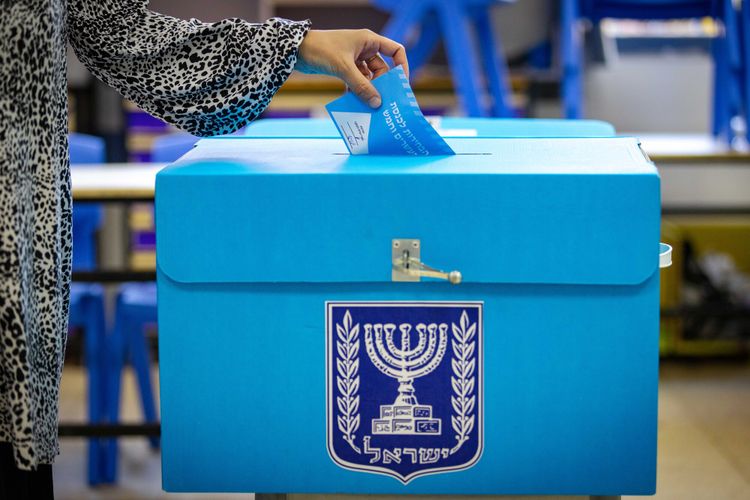 Israelis cast their ballots in the Israeli general elections, at a voting station in Jerusalem,on November 1, 2022.