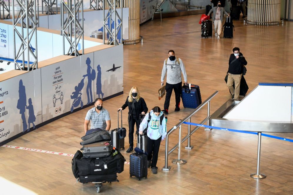 Travelers at the Ben Gurion International Airport
