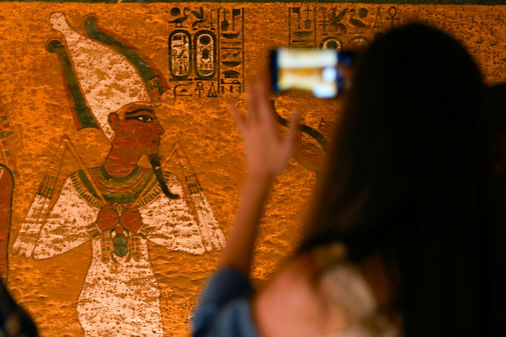 A tourist takes photos in Luxor, Egypt.