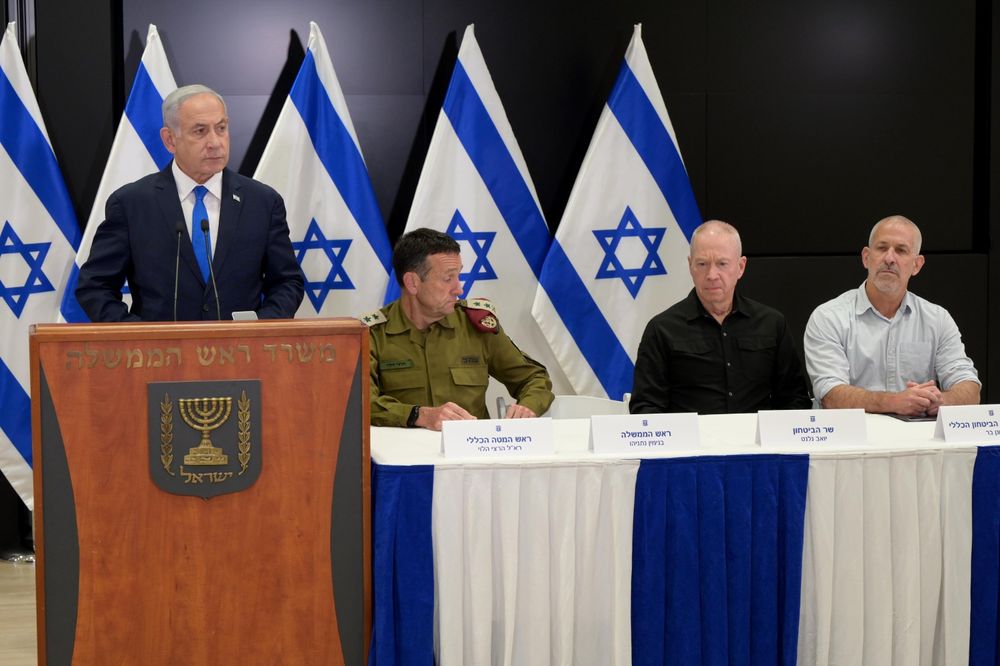 Israel's Prime Minister Benjamin Netanyahu (L) in a briefing alongside Defense Minister Yoav Gallant (2-R) as well as IDF chief Herzi Halevi (2-L) and Shin Bet head Ronen Bar.