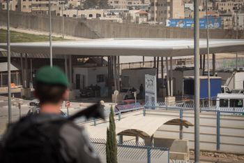 Israeli border police officers guard near the Qalandiya checkpoint in the West Bank, on March 27, 2018.
