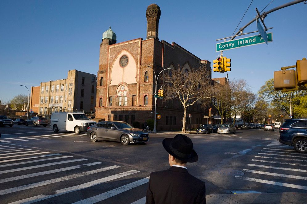 FILE- In this April 26, 2018 file photo, a Jewish boy walks to a yeshiva in the Brooklyn borough of New York