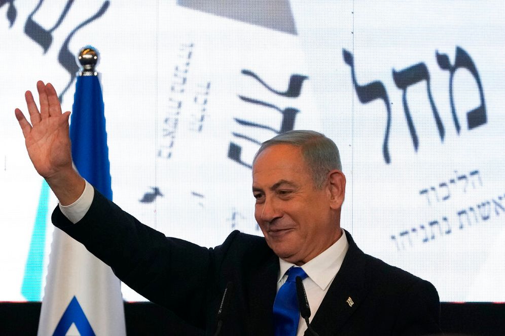 Benjamin Netanyahu, former Israeli prime minister and the head of the Likud party, waves to his supporters after first exit poll results for the Israeli parliamentary election at his party's headquarters in Jerusalem, Israel, November 2, 2022.