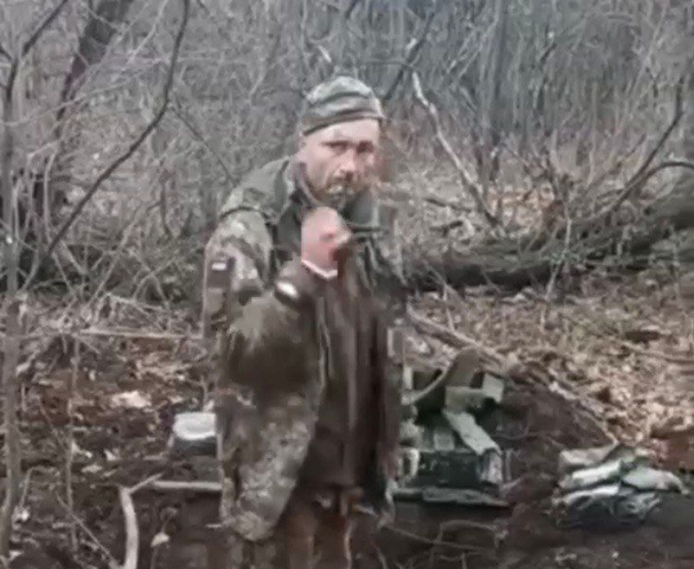 Screen grab of an unverified video showing the murder of a Ukrainian soldier.