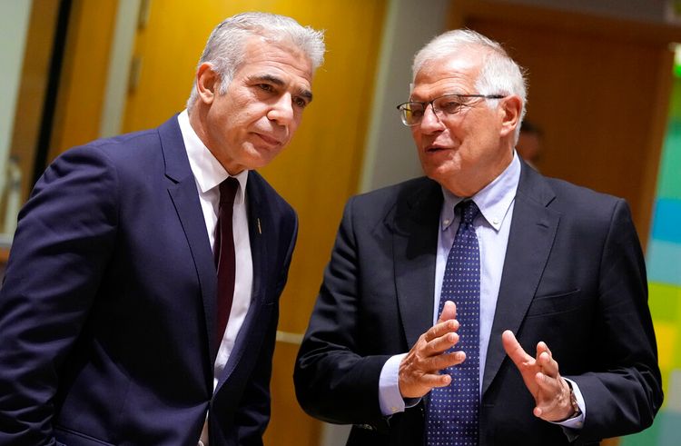 Then-Israeli foreign minister, now Prime Minister Yair Lapid (L) speaks with European Union foreign policy chief Josep Borrell in Brussels, Belgium, on July 12, 2021.