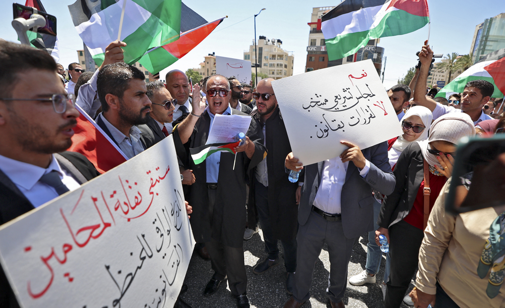 Palestinian lawyers protest outside the Prime Minister's office in the West Bank city of Ramallah on July 25, 2022