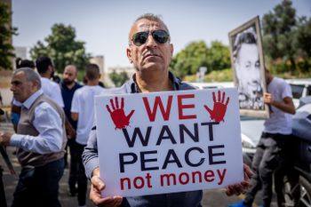 Members of Israel's Arab community protest against violence in their community, in Jerusalem.