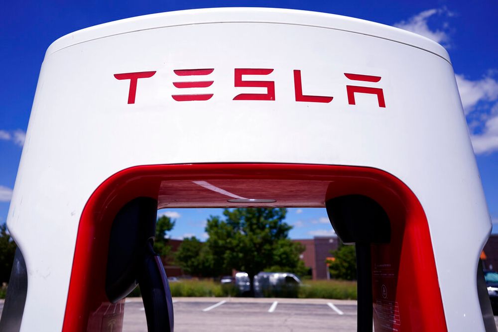 A Tesla Supercharger is seen in a parking lot in Illinois, the United States.