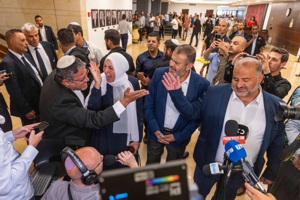 MK Itamar Ben-Gvir reacts during a press statement of United Arab List party MK Mansour Abbas at the Israeli parliament in Jerusalem, May 11, 2022.