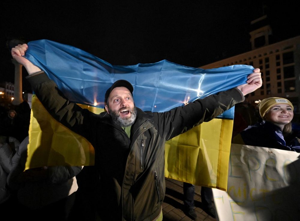 Ukrainians in the capital of Kyiv celebrating the liberation of Kherson, on November 11, 2022.