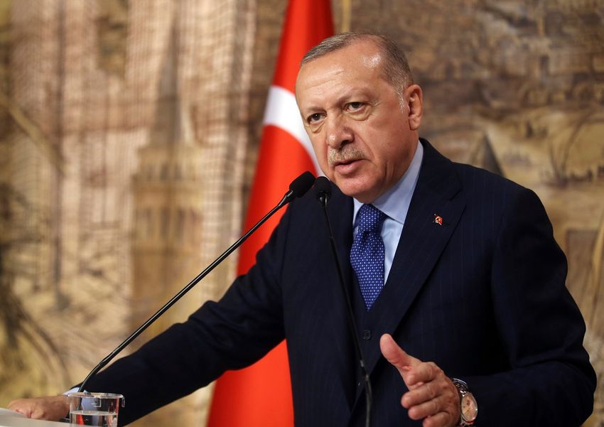 Turkey's President Recep Tayyip Erdogan speaks to his ruling party's lawmakers, in Istanbul, Saturday, Feb. 29, 2020