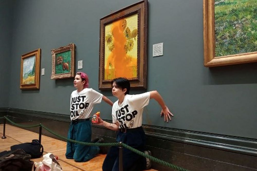 Environmental activists throw soup at a Van Gogh painting on display at the National Gallery in London, United Kingdom, October 14, 2022.