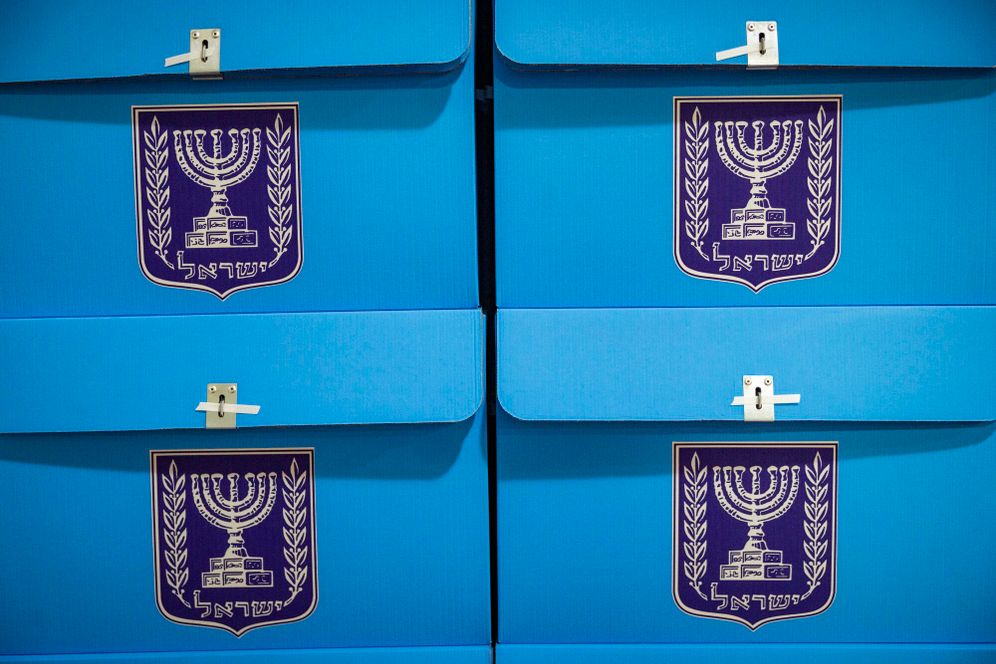 Photo by Yonatan Sindel/Flash90 Vote Israel Workers prepare ballot boxes for Israel’s upcoming general elections at the Central Elections Committee warehouse in Shoham, ahead of their distribution to polling stations across the country, October 14, 2026.