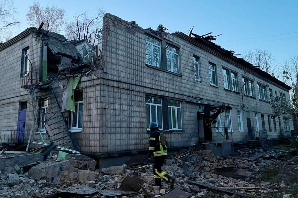 A rescuer working at the site of a drone attack in Kyiv on November 25, 2023.
