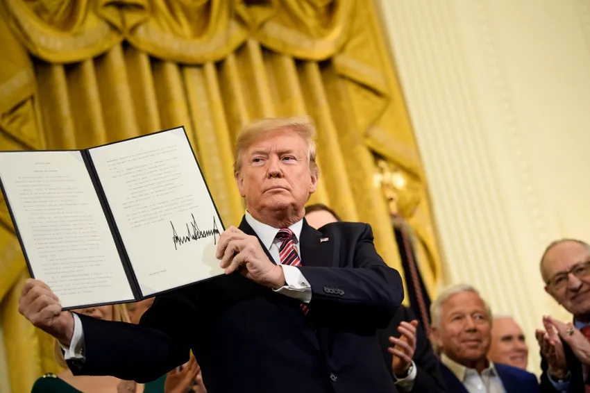US President Donald Trump shows an executive order regarding anti-semitism during a Hanukkah reception in the East Room of the White House December 11, 2019, in Washington, DC.