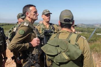 IDF Chief of Staff Herzi Halevi (L) conducts a security assessment along the Israel-Lebanon border, with the commander of the Northern Command and other army officials.